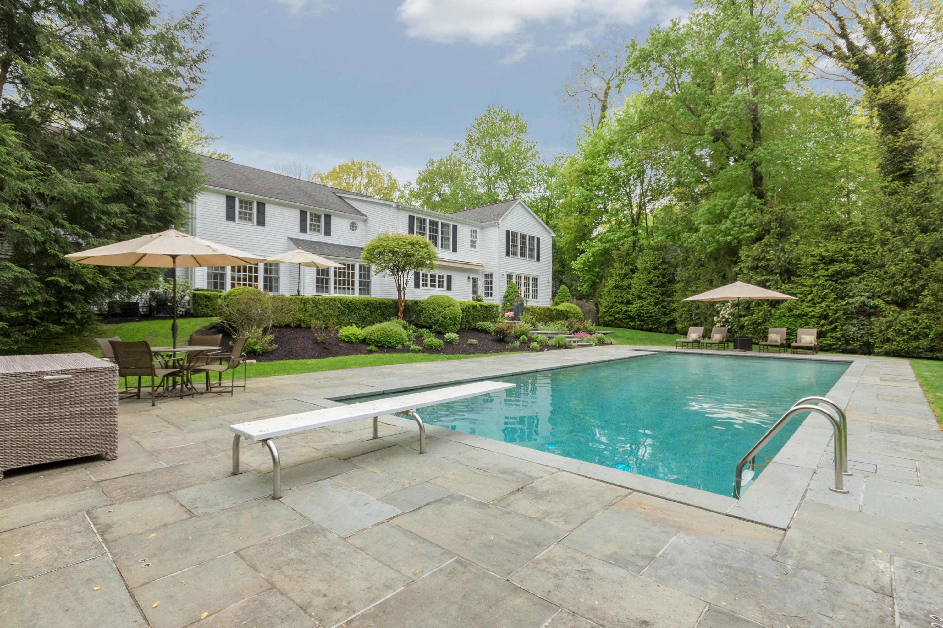 280 Hollow Tree Ridge Road Darien, CT 06820 - Photo 62 of 66 a view of a swimming pool with a patio