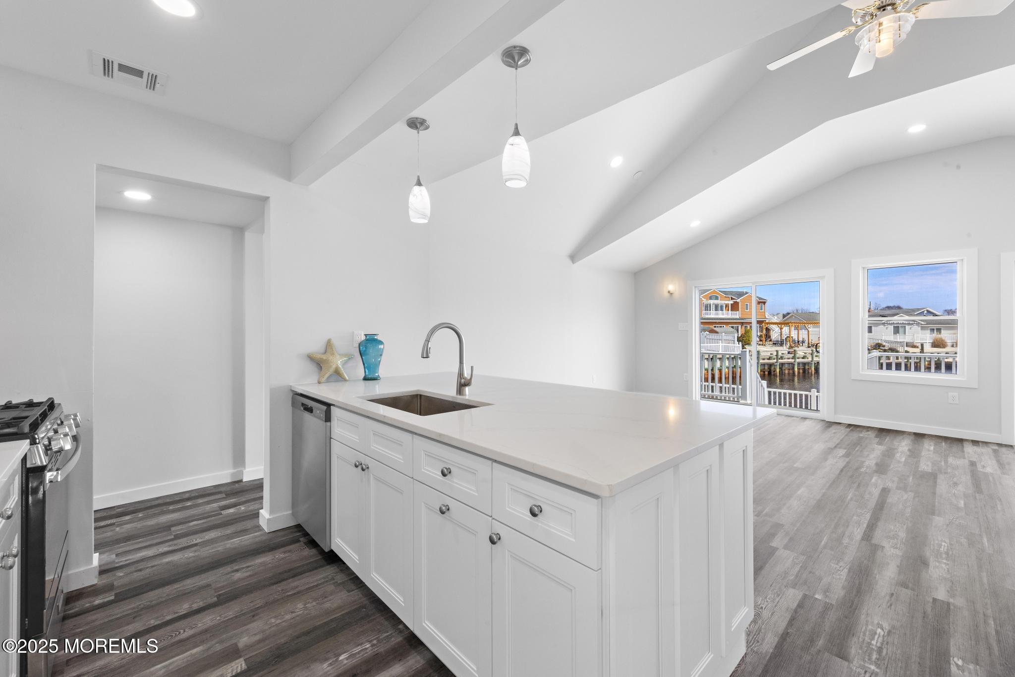 157 Rodman Drive Beach Haven West, NJ 08050 - Photo 11 of 44 a view of a center island and wooden floor