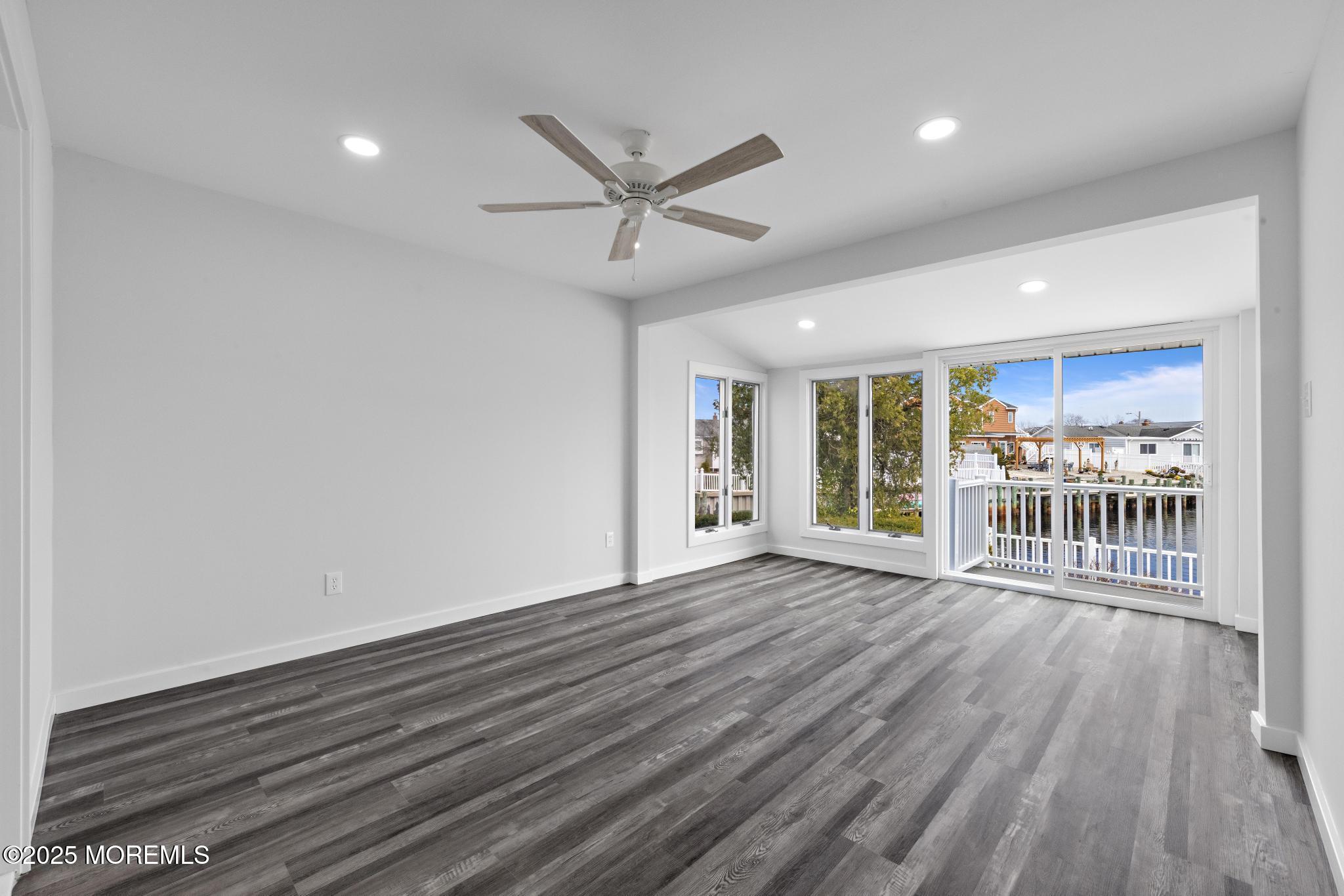 157 Rodman Drive Beach Haven West, NJ 08050 - Photo 15 of 44 a view of an empty room with wooden floor and a window