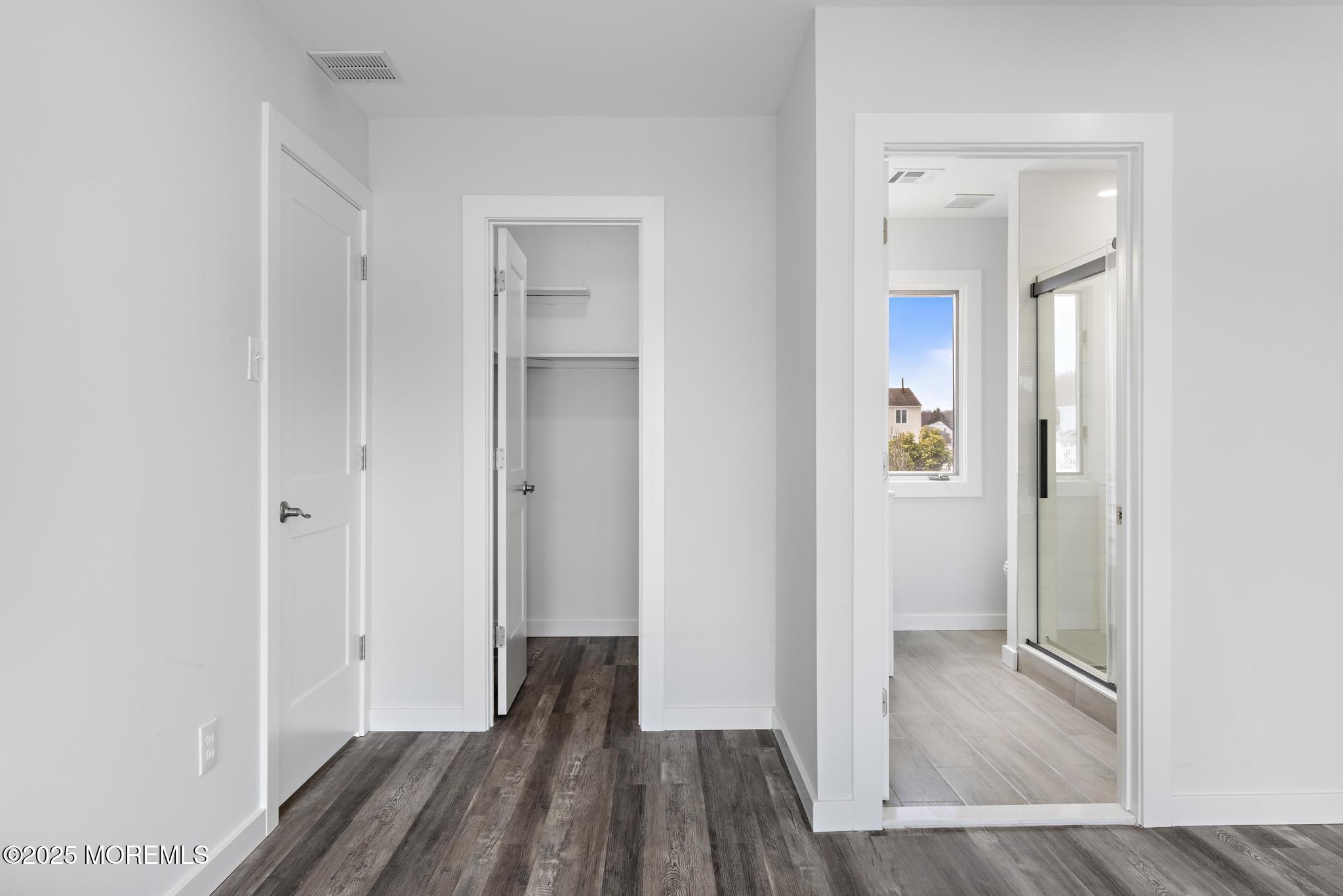 157 Rodman Drive Beach Haven West, NJ 08050 - Photo 18 of 44 a view of a hallway with wooden floor and staircase
