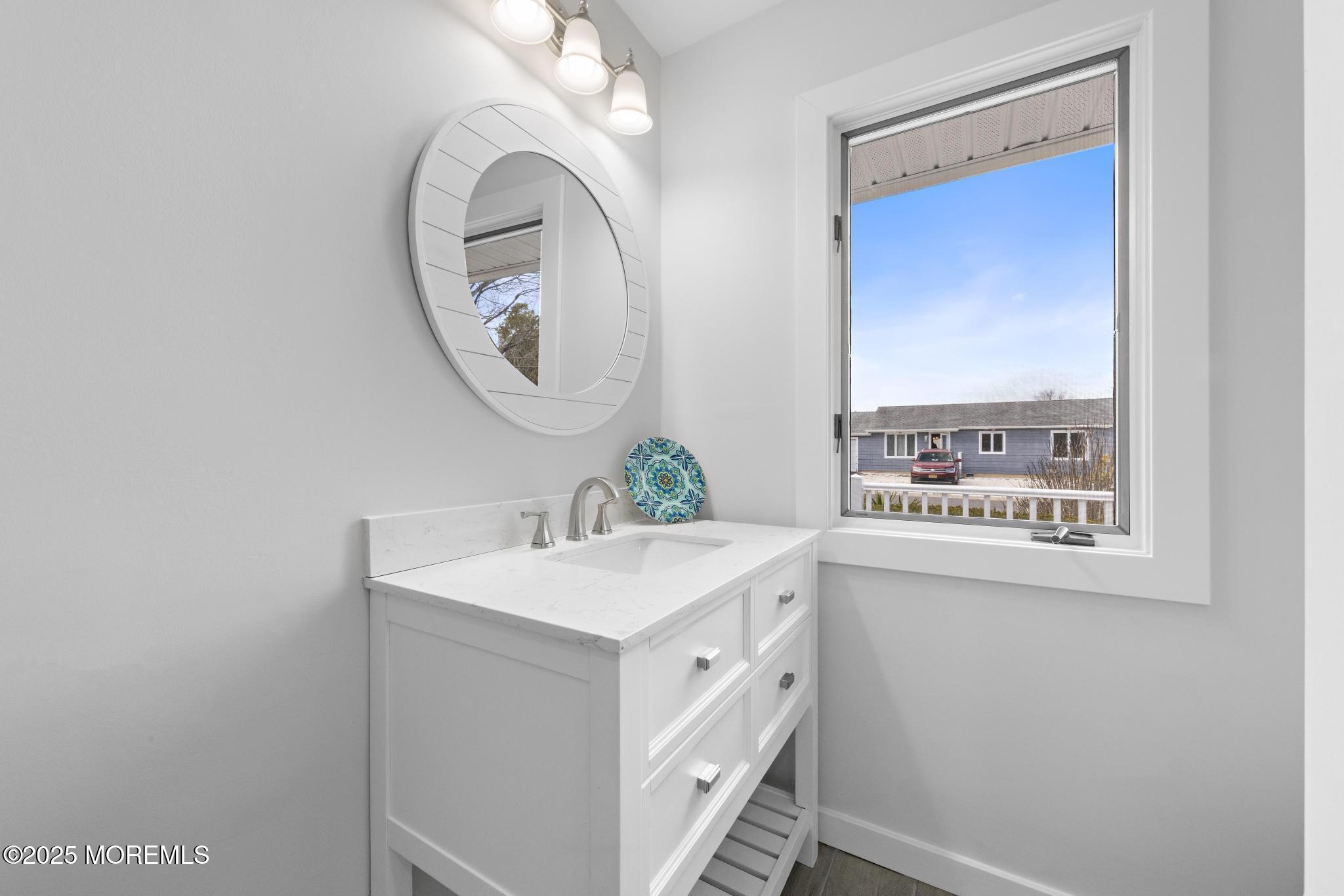157 Rodman Drive Beach Haven West, NJ 08050 - Photo 27 of 44 a bathroom with a sink and a mirror