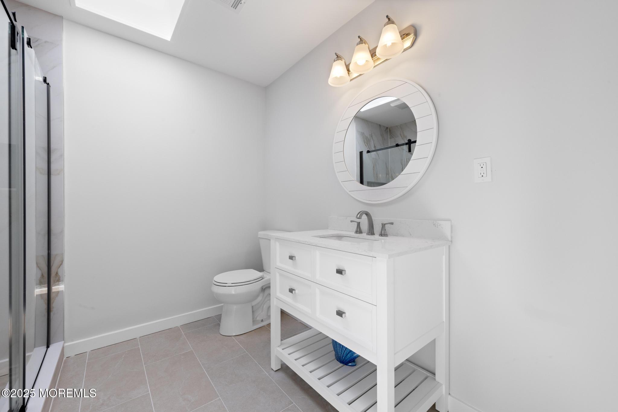157 Rodman Drive Beach Haven West, NJ 08050 - Photo 28 of 44 a bathroom with a sink and a mirror