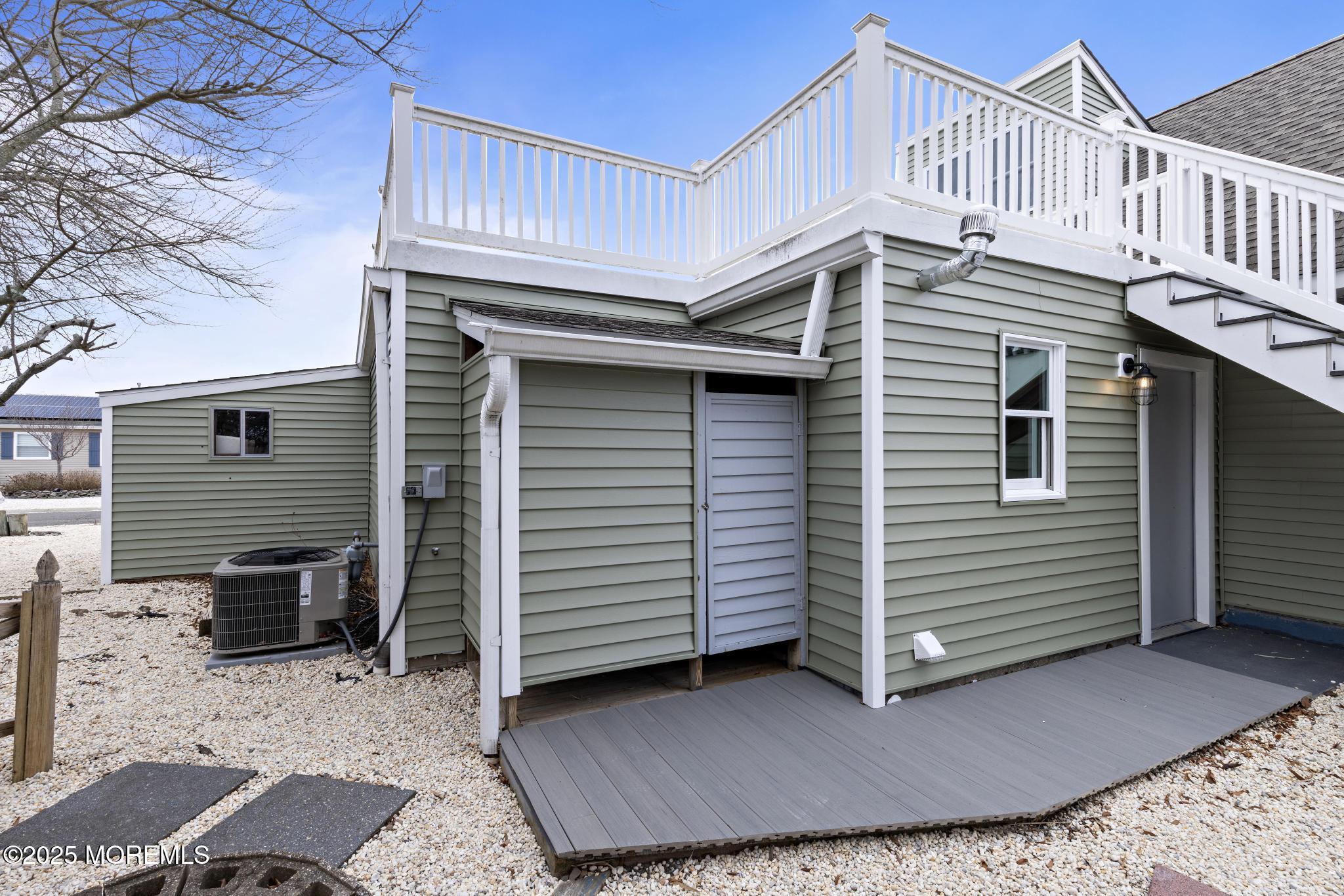 157 Rodman Drive Beach Haven West, NJ 08050 - Photo 33 of 44 a view of a house with a balcony