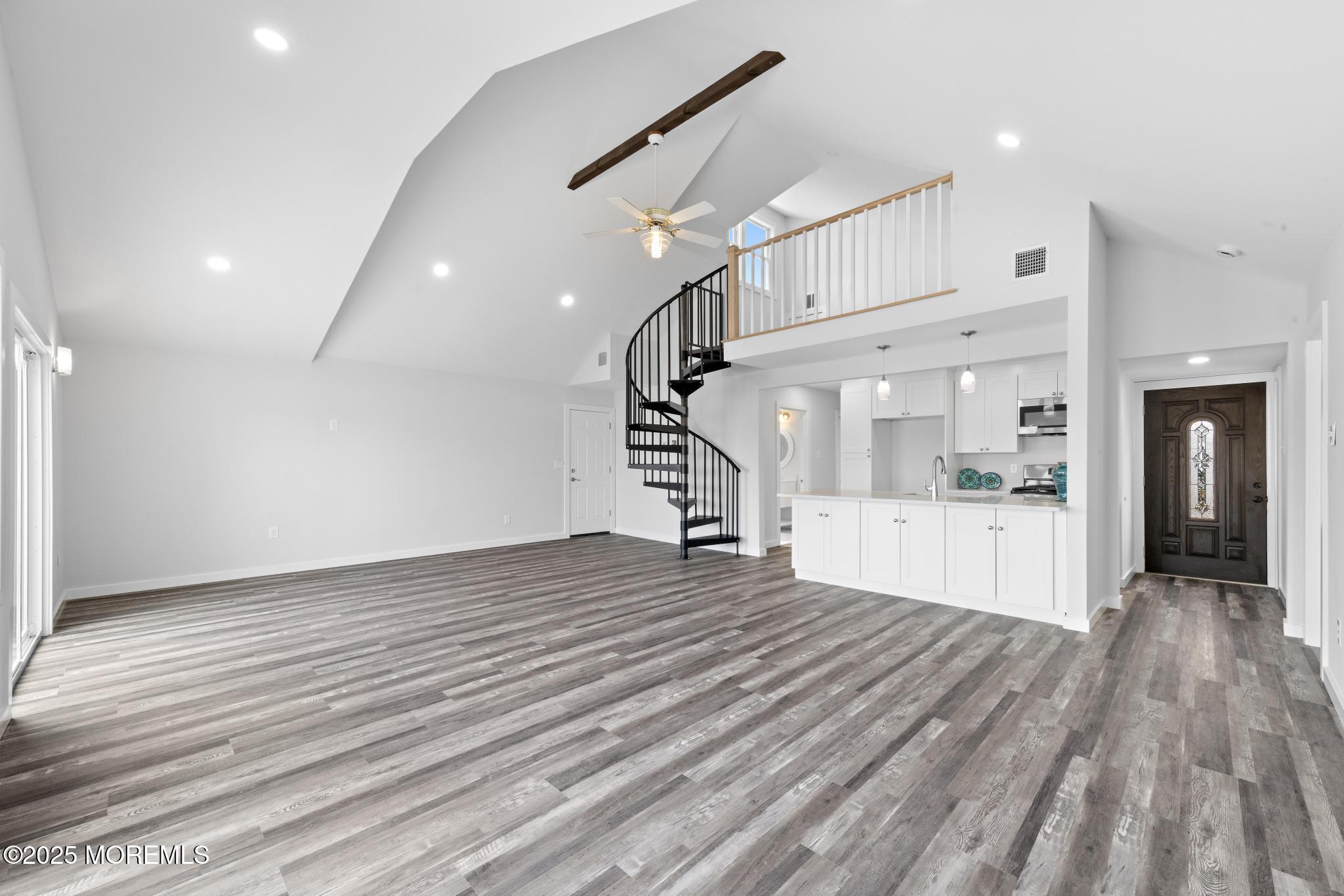 157 Rodman Drive Beach Haven West, NJ 08050 - Photo 7 of 44 a view of a room with wooden floor and stairs