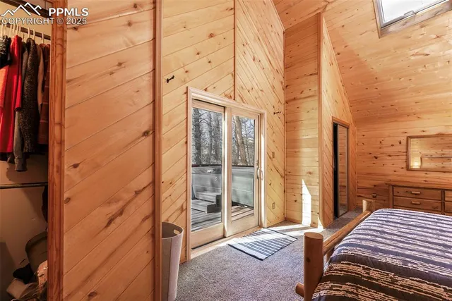 a bedroom with a bed and a desk