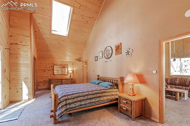 a bedroom with a bed and a lamp with window