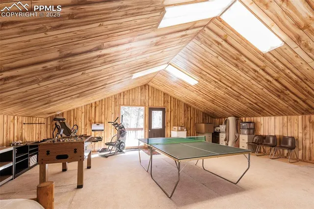 a view of a patio with table and chairs with wooden floor