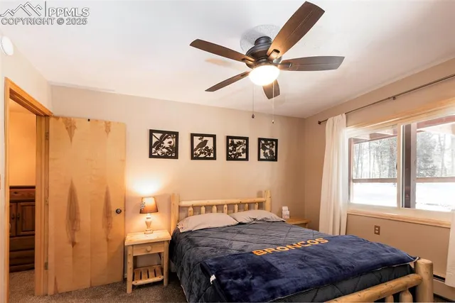 a bedroom with a bed and a mirror