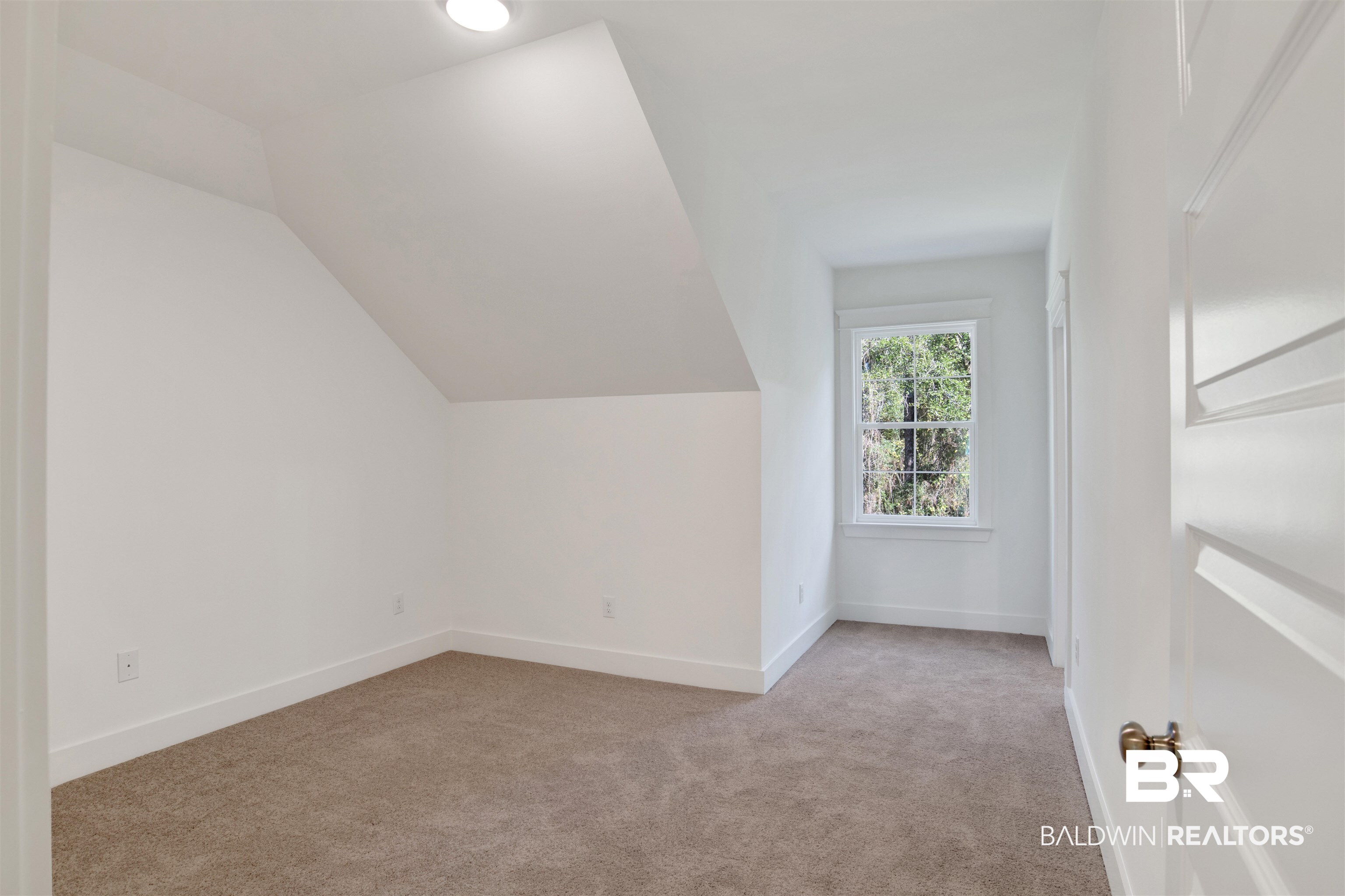 5 Long Leaf Circle Fairhope, AL 36532 - Photo 34 of 44 Additional living space featuring light colored carpet and vaulted ceiling