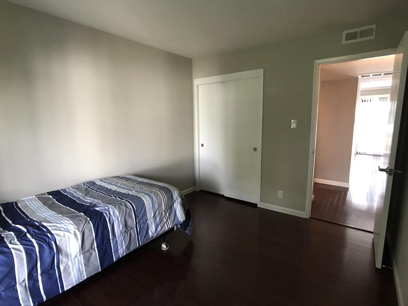 1925 46th Avenue, Unit 60 Capitola, CA 95010 - Photo 12 of 26 a bedroom with a bed and a window