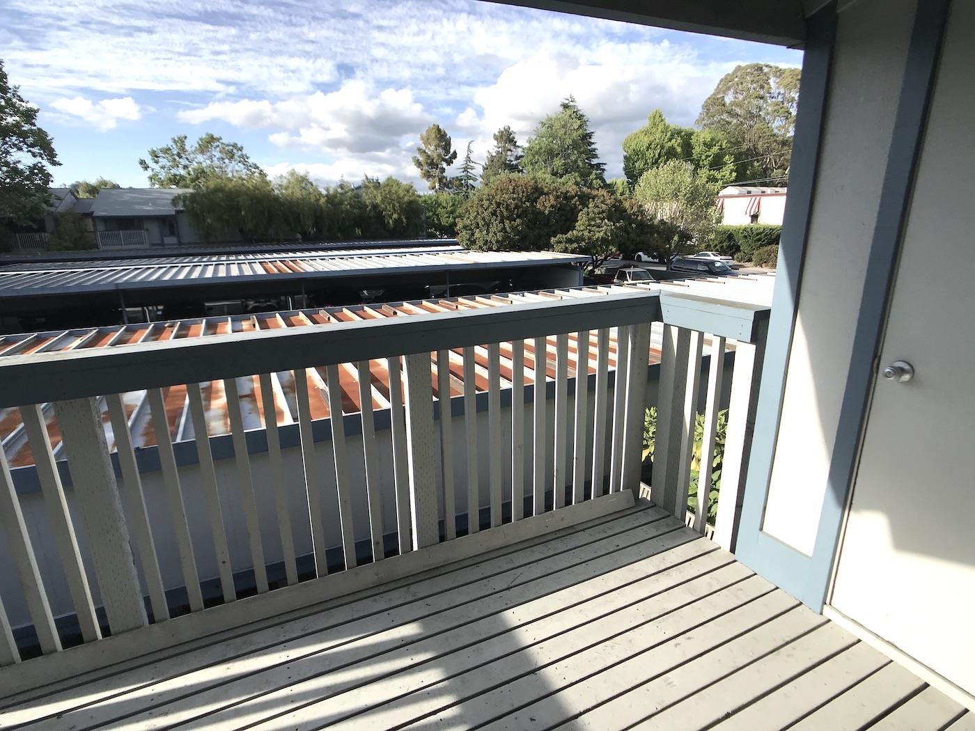 1925 46th Avenue, Unit 60 Capitola, CA 95010 - Photo 17 of 26 a view of a wooden balcony with a swing