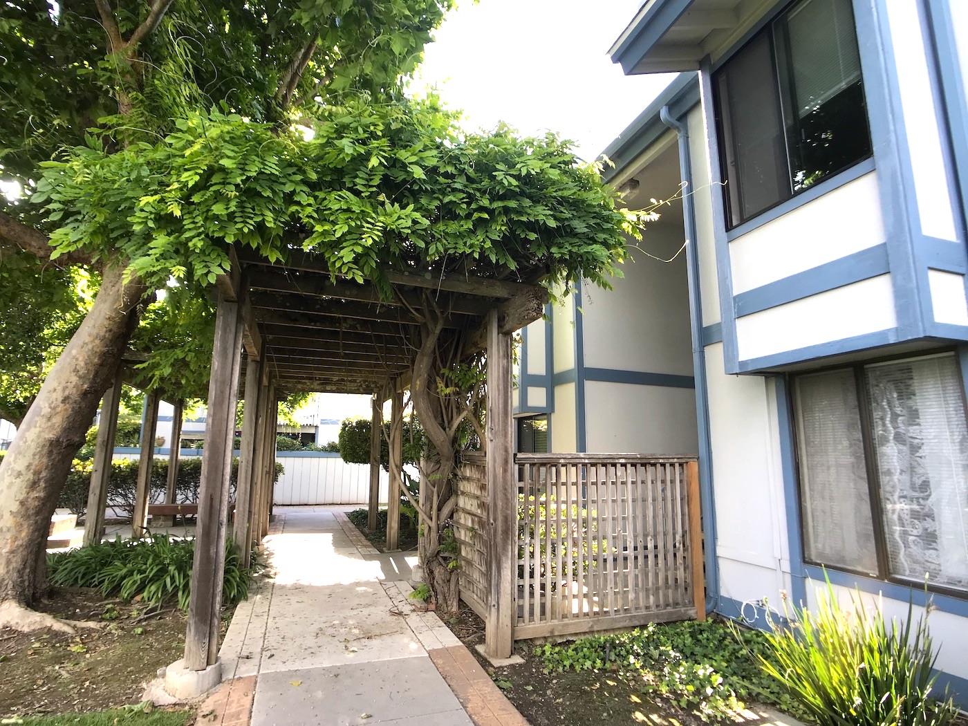 1925 46th Avenue, Unit 60 Capitola, CA 95010 - Photo 23 of 26 a side view of a house with a tree