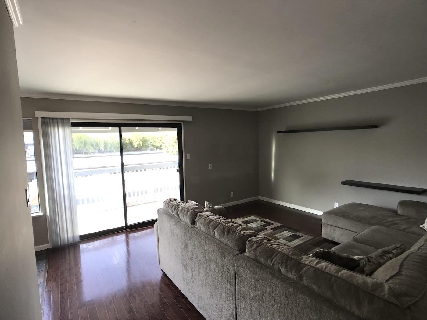 1925 46th Avenue, Unit 60 Capitola, CA 95010 - Photo 7 of 26 a living room with furniture and a floor to ceiling window