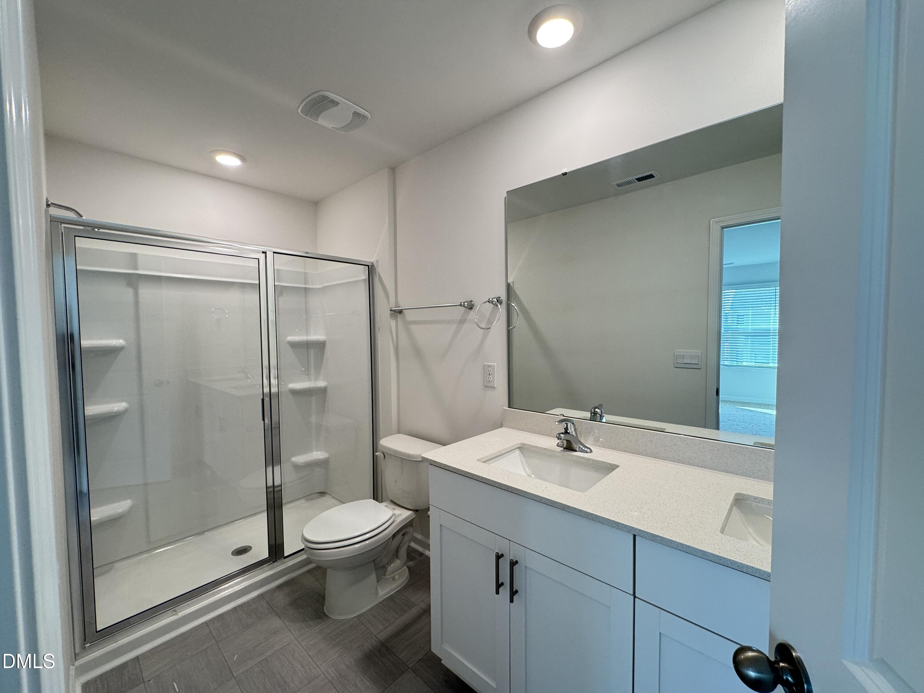 413 Belgian Red Way Wake Forest, NC 27587 - Photo 13 of 19 a bathroom with a shower sink mirror and toilet