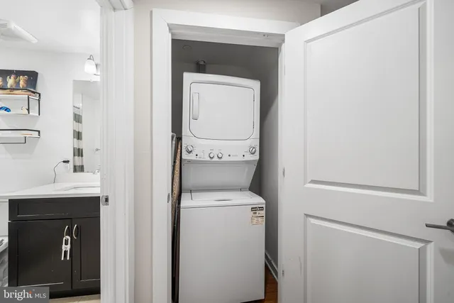 a hallway with a washer and dryer