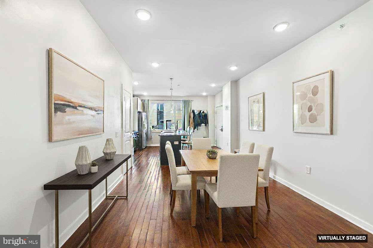 1640 North 5th Court, Unit 29A Philadelphia, PA 19122 - Photo 4 of 21 a view of a dining room with furniture and wooden floor