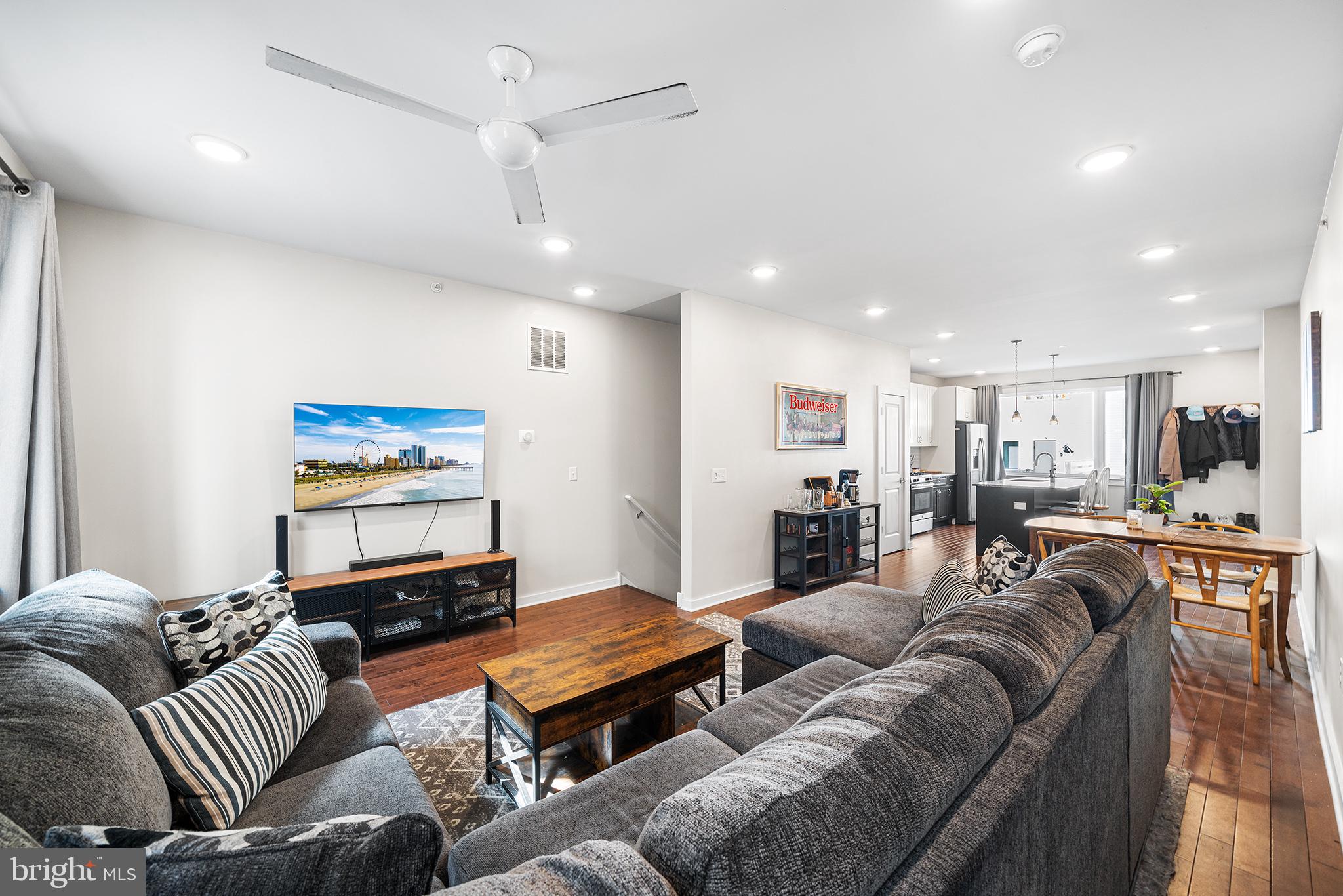 1640 North 5th Court, Unit 29A Philadelphia, PA 19122 - Photo 7 of 21 a living room with furniture kitchen view and a flat screen tv