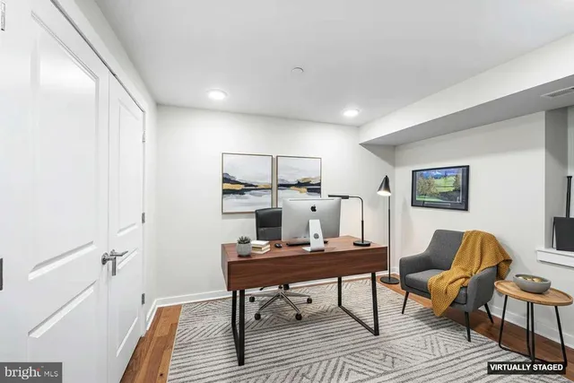 a workspace with furniture and window