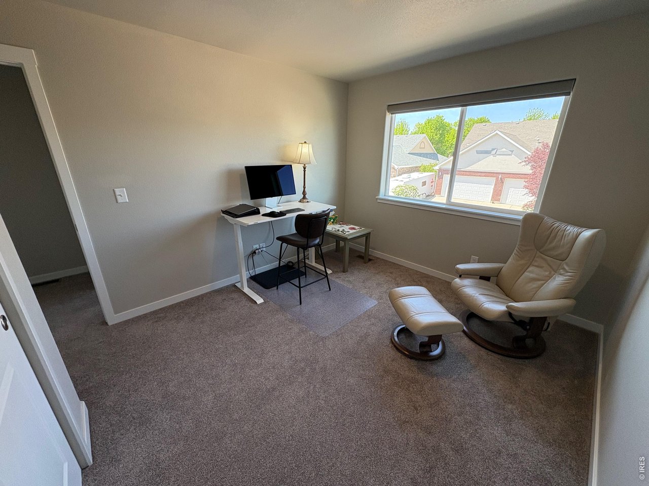 333 Pyramid Peak Street Berthoud, CO 80513 - Photo 19 of 21 a living room with furniture and a window