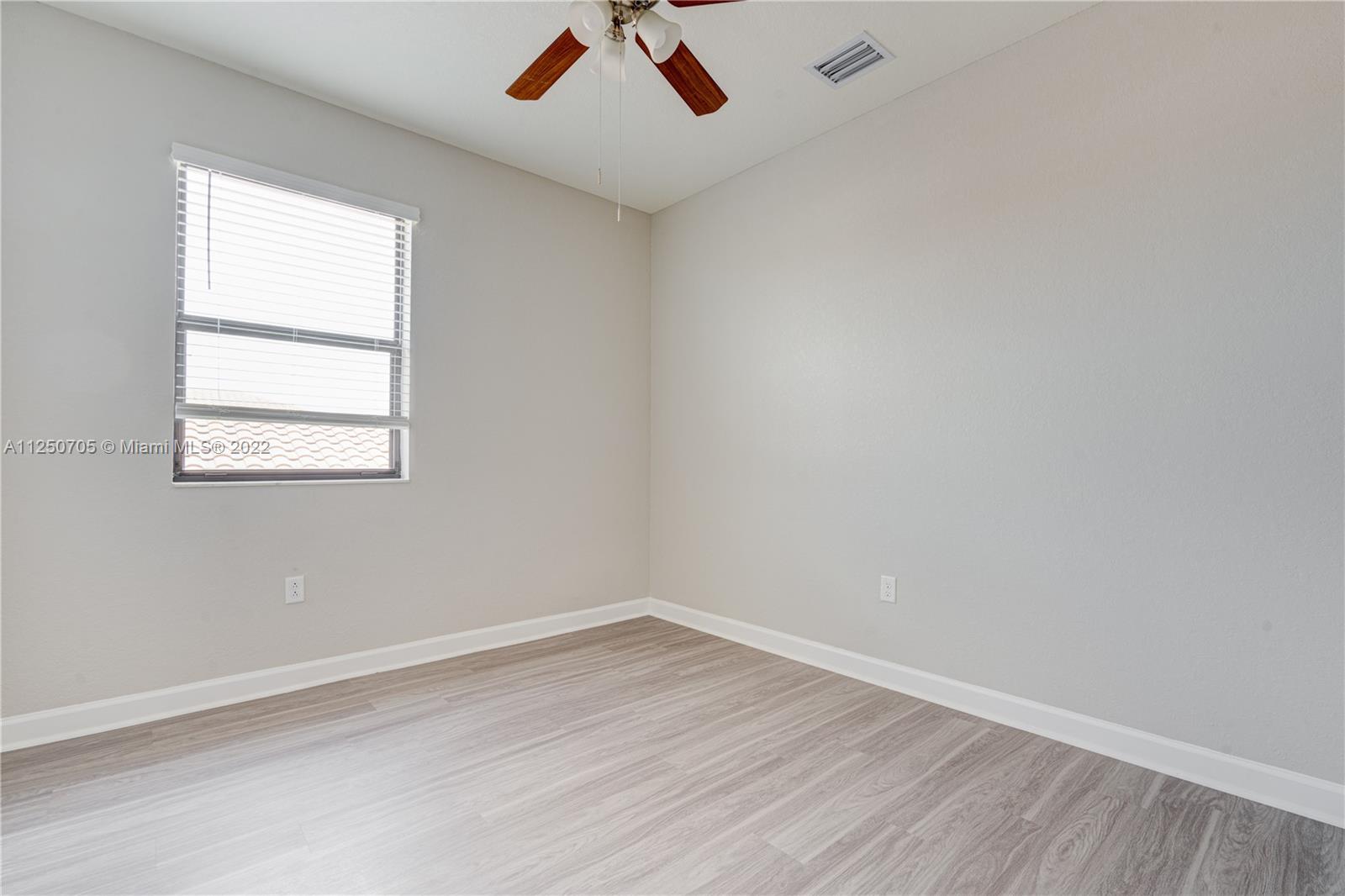 124 Northeast 25th Avenue Homestead, FL 33033 - Photo 19 of 32 an empty room with a window