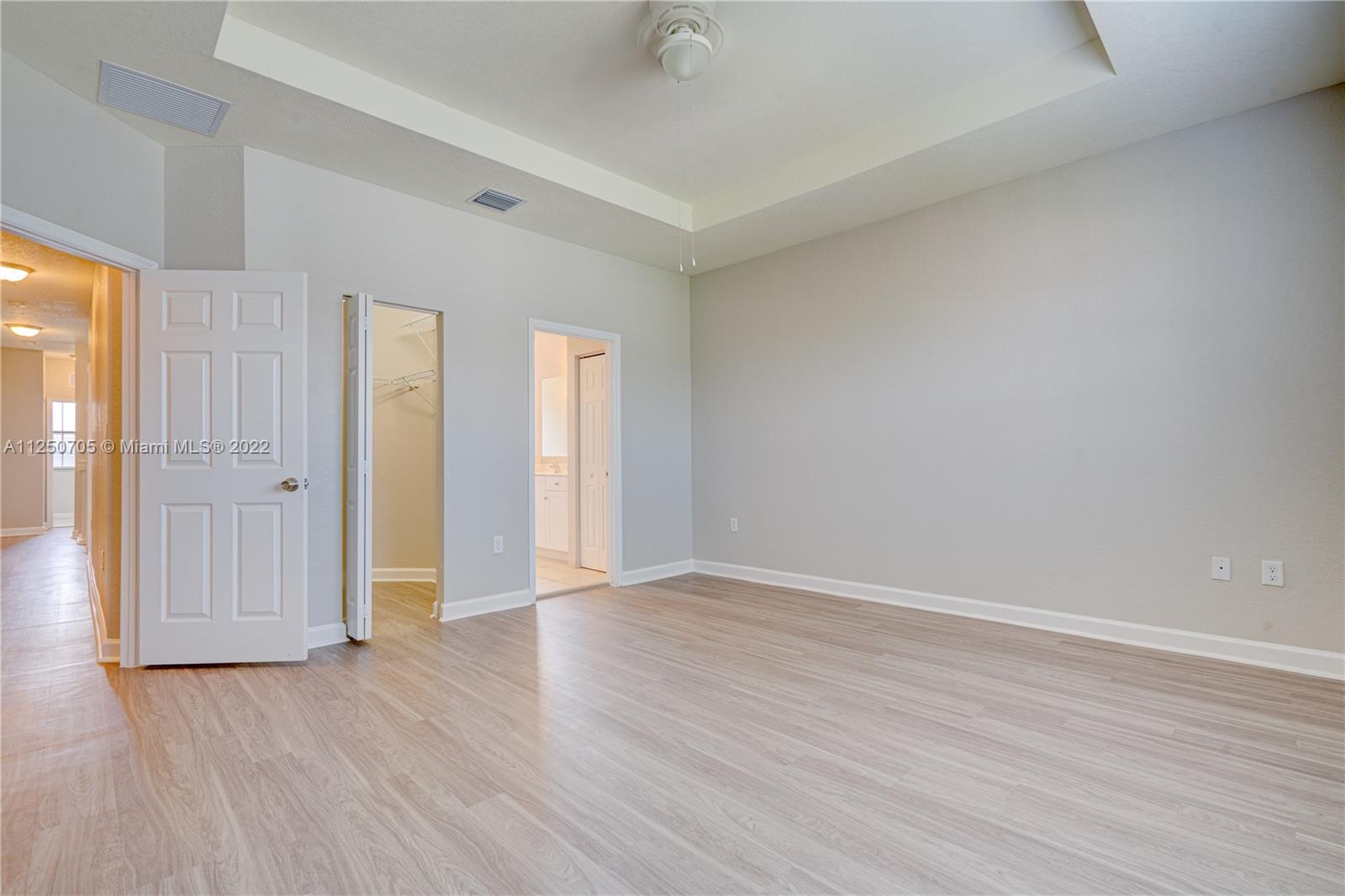 124 Northeast 25th Avenue Homestead, FL 33033 - Photo 24 of 32 a view of an empty room with wooden floor