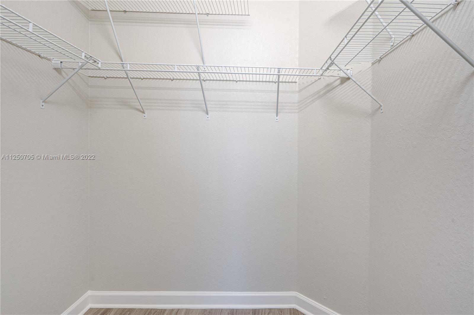 124 Northeast 25th Avenue Homestead, FL 33033 - Photo 26 of 32 a view of a room with racks on the wall