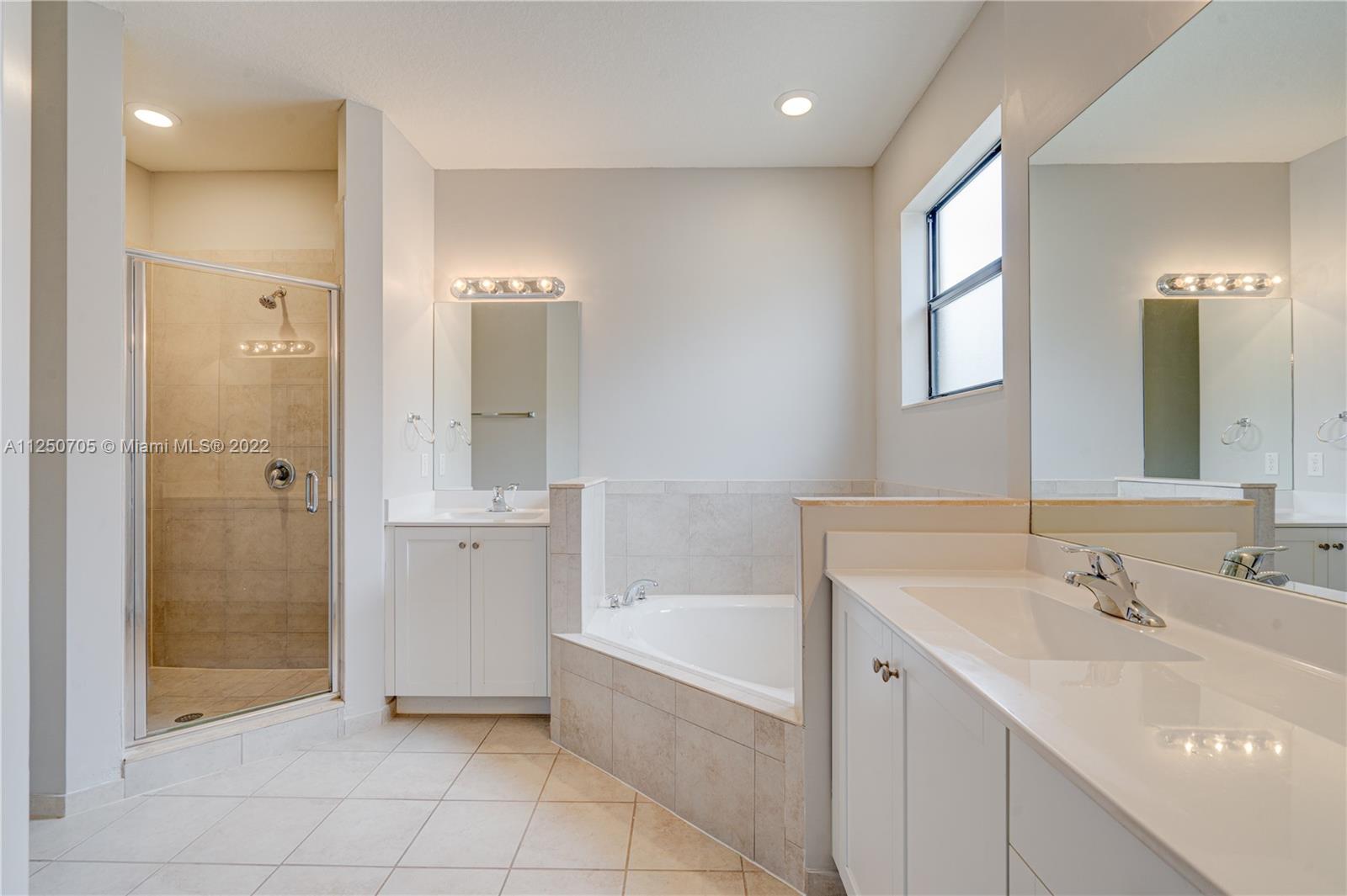 124 Northeast 25th Avenue Homestead, FL 33033 - Photo 27 of 32 a bathroom with a bathtub and a sink