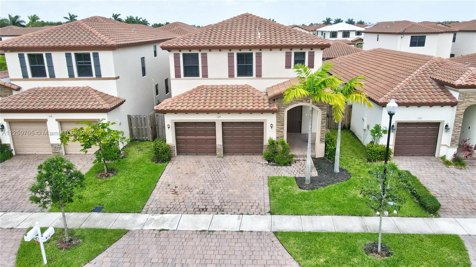 124 Northeast 25th Avenue Homestead, FL 33033 - Photo 30 of 32 a front view of a house with a garden