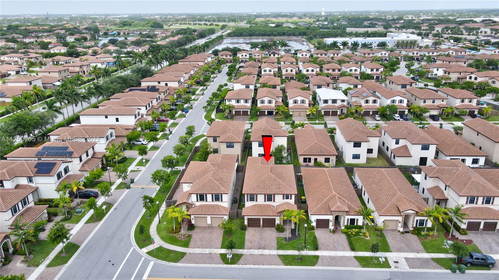 124 Northeast 25th Avenue Homestead, FL 33033 - Photo 31 of 32 an aerial view of residential houses with outdoor space and parking