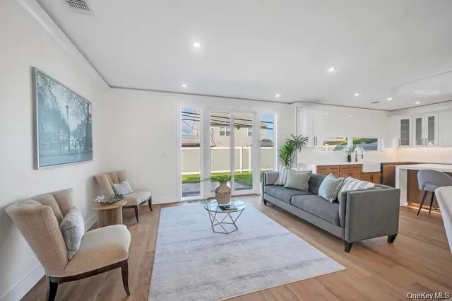 a living room with furniture or couch and a dining table