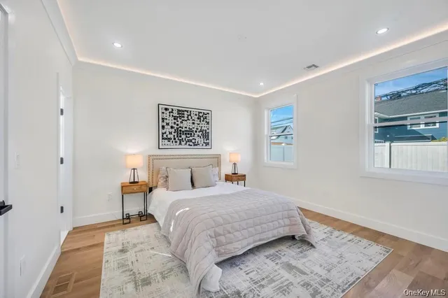 a bedroom with a bed and a lamp