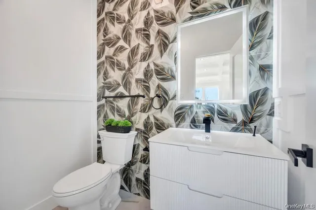 a bathroom with a toilet and a shower curtain