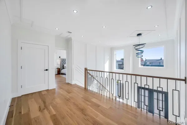 a view of hallway with wooden floor