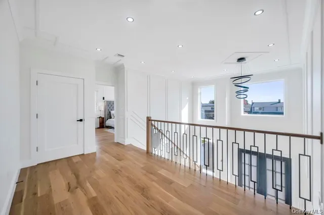 a view of hallway with wooden floor