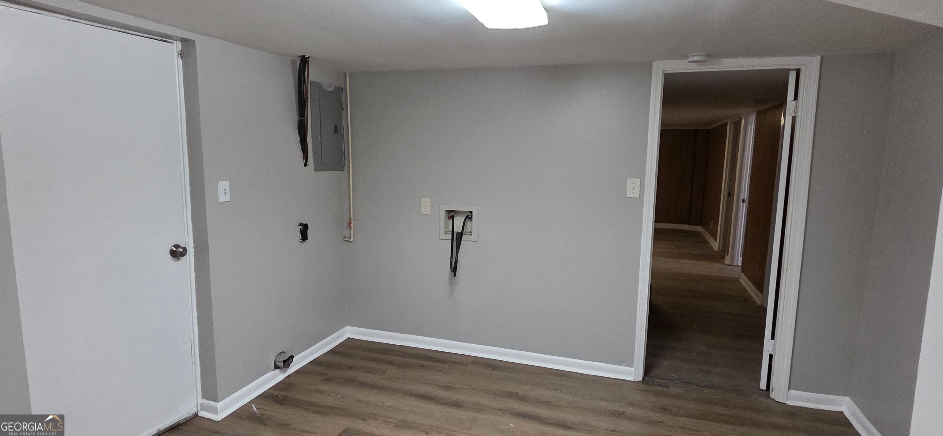 449 Charter Oak Drive Southwest Atlanta, GA 30331 - Photo 12 of 15 The large space in this room provides plenty of options for storage, an office, exercise equipment and more.