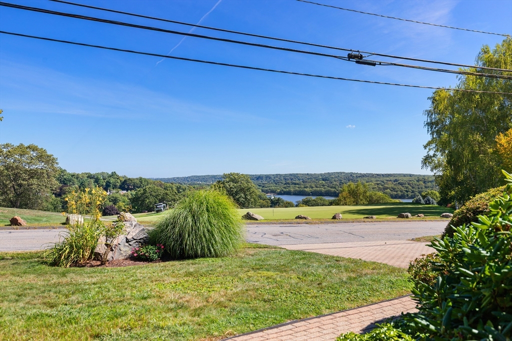58 Hutchinson Road Arlington, MA 02474 - Photo 3 of 40 a view of a lake with a building in the background