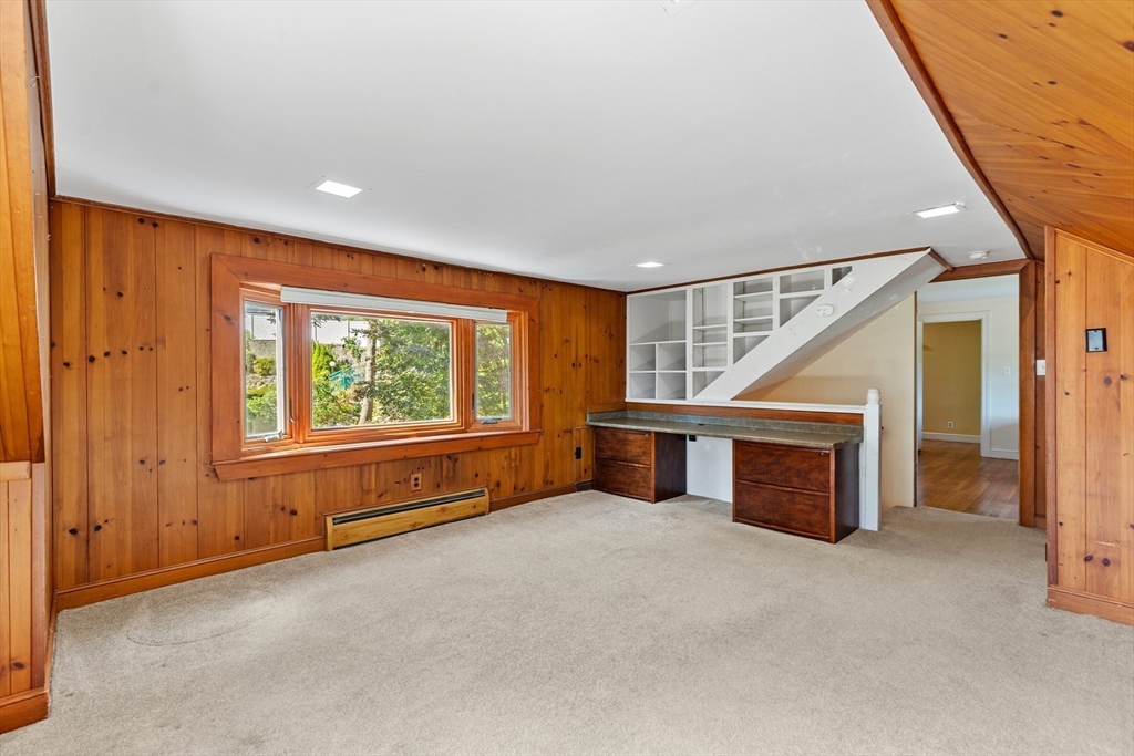 58 Hutchinson Road Arlington, MA 02474 - Photo 31 of 40 an empty room with furniture and windows