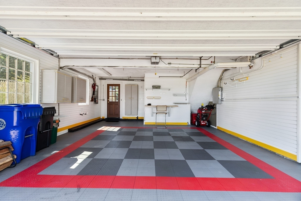 58 Hutchinson Road Arlington, MA 02474 - Photo 32 of 40 a view of empty room with wooden floor and windows