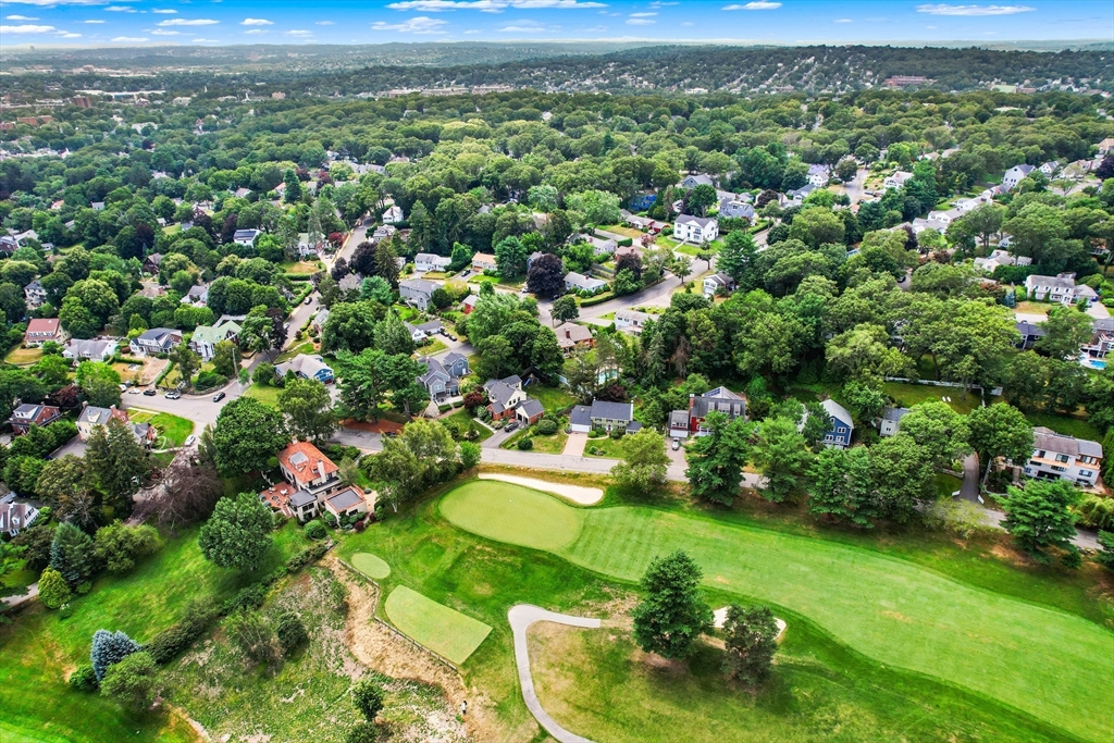 58 Hutchinson Road Arlington, MA 02474 - Photo 4 of 40 a view of a city with lush green forest