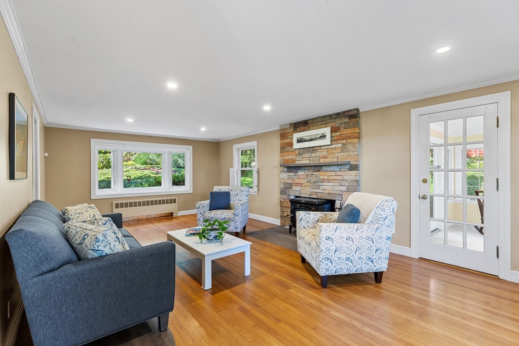 58 Hutchinson Road Arlington, MA 02474 - Photo 8 of 40 a living room with furniture and a fireplace