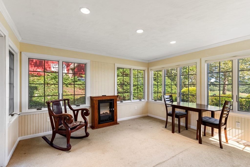 58 Hutchinson Road Arlington, MA 02474 - Photo 10 of 40 a living room with furniture and a floor to ceiling window