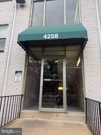 4258 Buckman Road, Unit 38 Alexandria, VA 22309 - Photo 2 of 7 Inviting entrance with green awning.