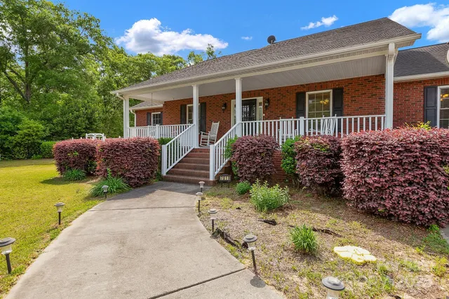 a view of staircase with wooden floor and fence