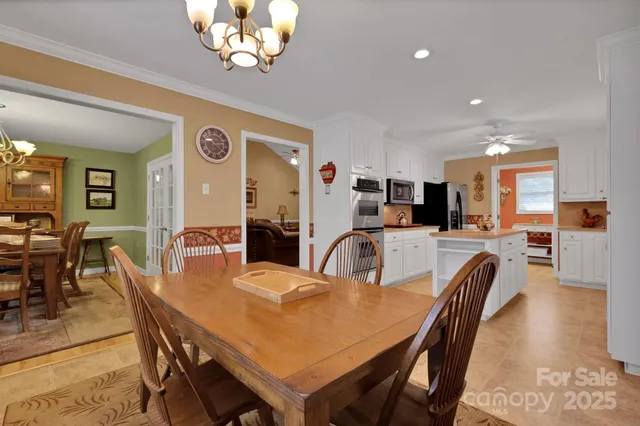 a kitchen with a stove a sink and a refrigerator