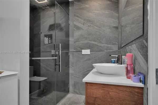 a bathroom with a sink and toilet