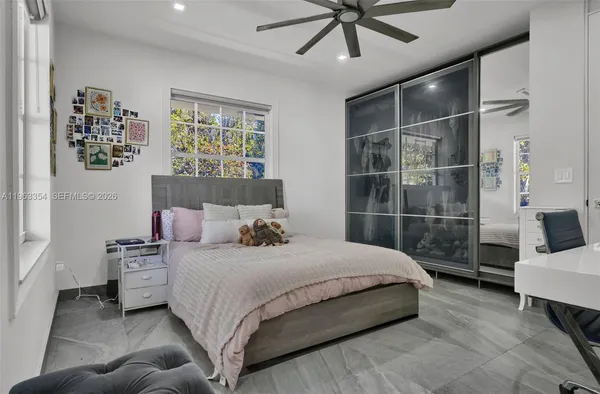 a bedroom with a bed and window