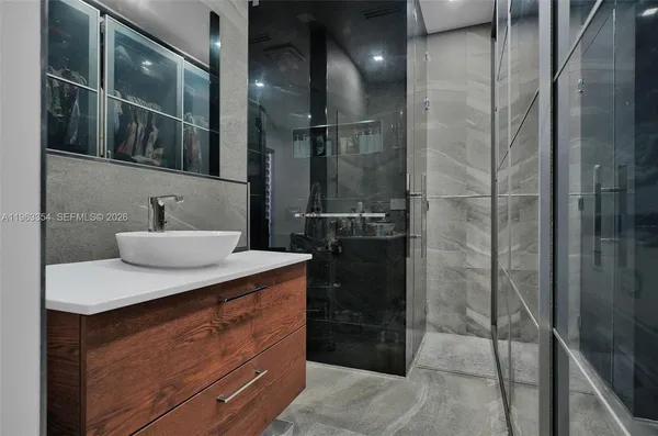 a bathroom with a sink and a mirror