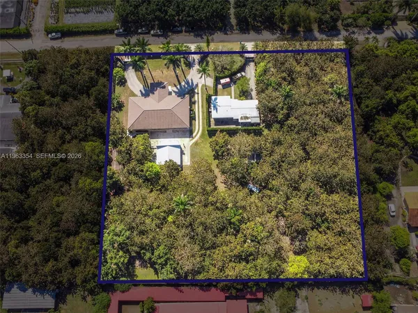 an aerial view of a house having swimming pool