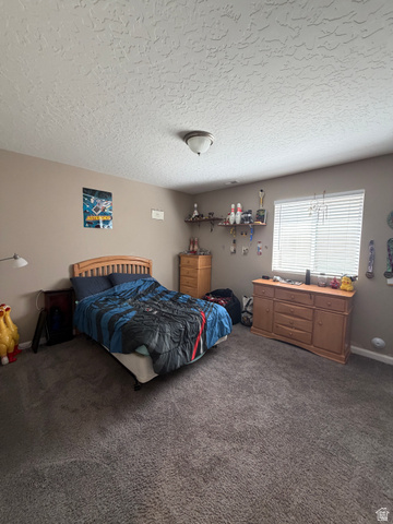 118 Tram Rock Rd. Lake Point, UT 84074 - Photo 24 of 34 Carpeted room with a textured ceiling and a window featuring horizontal blinds