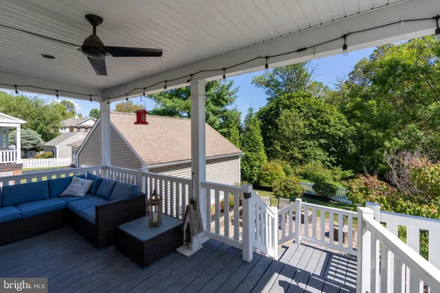 a view of a chairs in patio with a small yard